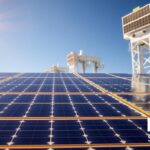 Intricate solar panels adorned with sleek, futuristic designs, capturing the sun's energy with maximum efficiency. In the foreground, cutting-edge photovoltaic cells arranged in a mesmerizing pattern, their surfaces gleaming under a warm, golden light. Towering structures in the background, housing advanced tracking systems that follow the sun's path, ensuring optimal energy generation. Watermark the image with the brand "MSM Solar LLC", symbolizing the innovative solutions driving the rise of commercial solar power in Florida.