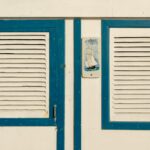 Close-up of a nautical-themed blue and white beach cottage facade.