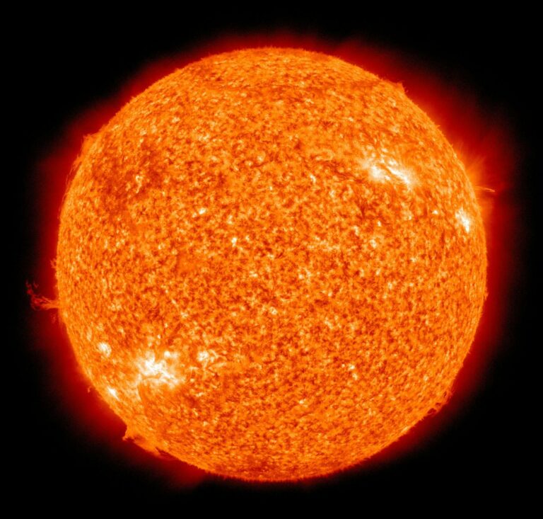 Detailed image of the sun showcasing its fiery surface and glowing edges.