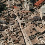 Aerial view of aged stone residential houses located in living district of old town