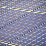 Detailed view of solar panels in a solar farm highlighting renewable energy technology.
