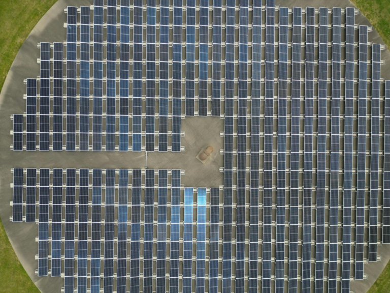 Aerial view of large solar panel array generating renewable energy.