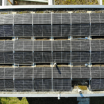 Aerial view of solar panels on a rooftop in Zurich, showcasing clean energy solutions.