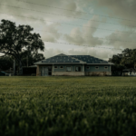A sustainable home with solar panels in a lush Florida setting, showcasing green energy.
