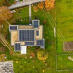 Aerial shot of a building with solar panels in a green landscape in Garešnica, Croatia.