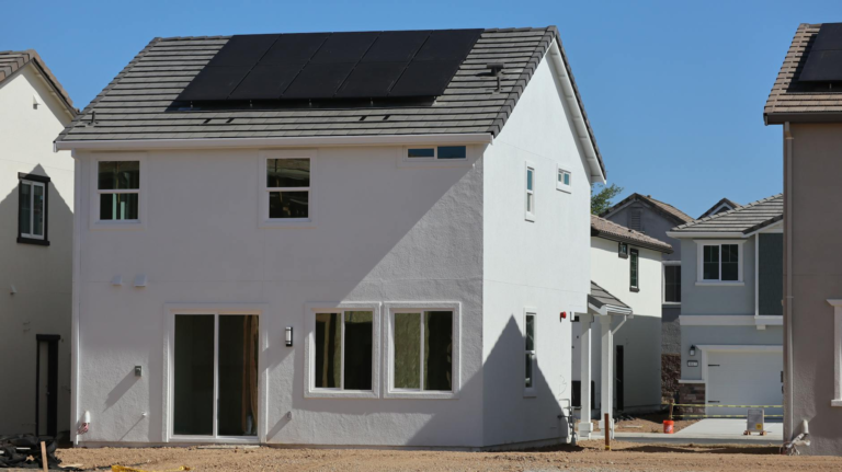 Newly constructed eco-friendly home in Elk Grove, CA, featuring rooftop solar panels for sustainable energy.