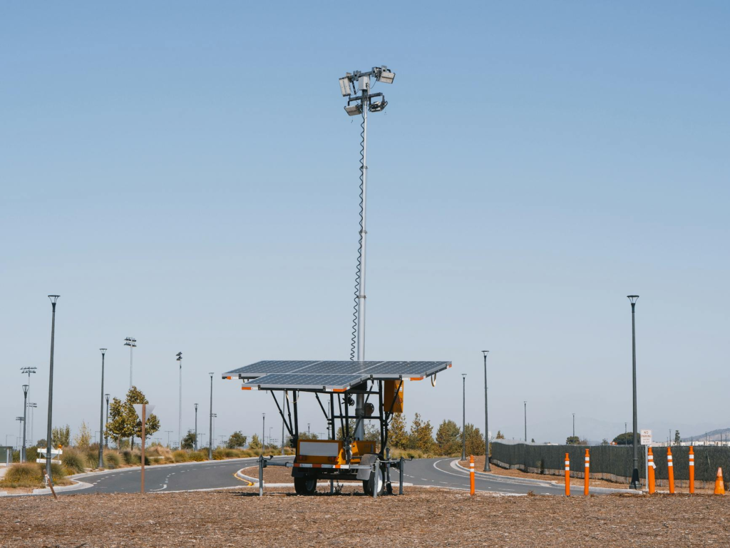 Solar powered streetlights under a clear blue sky, emphasizing renewable energy.