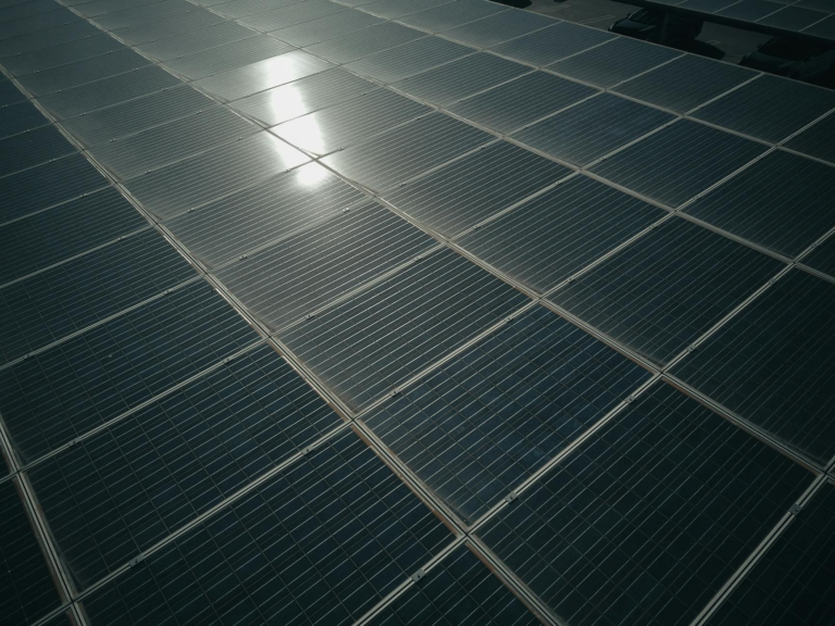 Captivating close-up of solar panels reflecting sunlight, showcasing renewable energy technology.