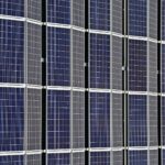 Close-up of multiple solar panels representing renewable energy and sustainability.