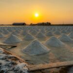 Beautiful sunset over traditional salt fields in Bangkok, Thailand.