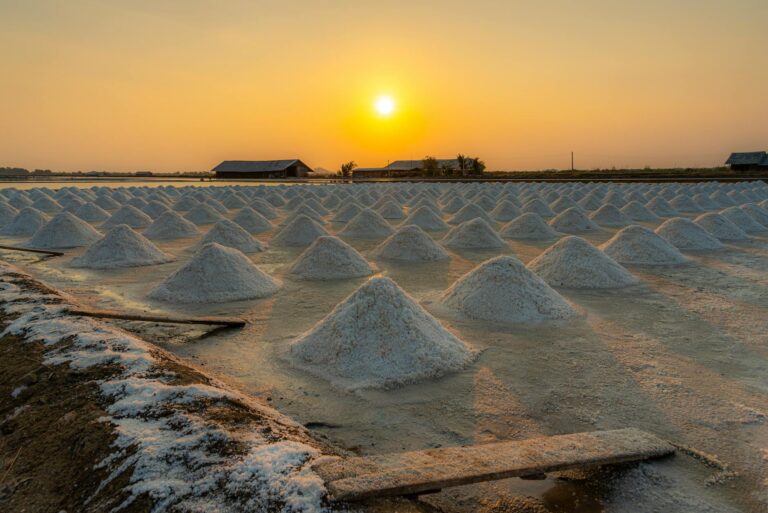 Beautiful sunset over traditional salt fields in Bangkok, Thailand.