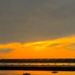 Captivating view of solar panels beneath a vibrant sunset sky in Niğde, Türkiye.
