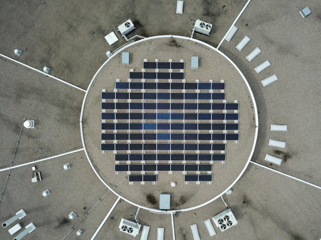 Aerial photo of a solar panel grid on a rooftop, maximizing renewable energy.