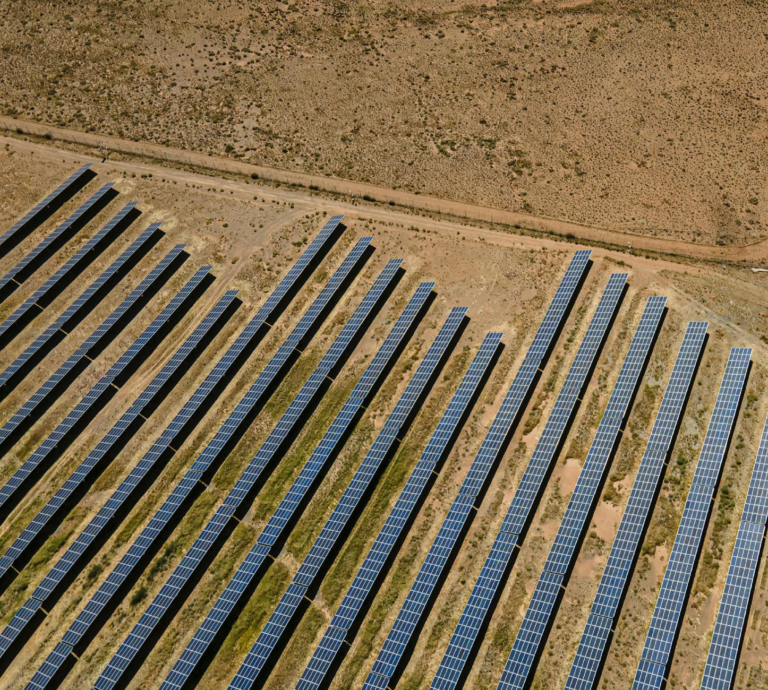 Aerial shot of solar panels in De Aar, illustrating sustainable energy in South Africa.