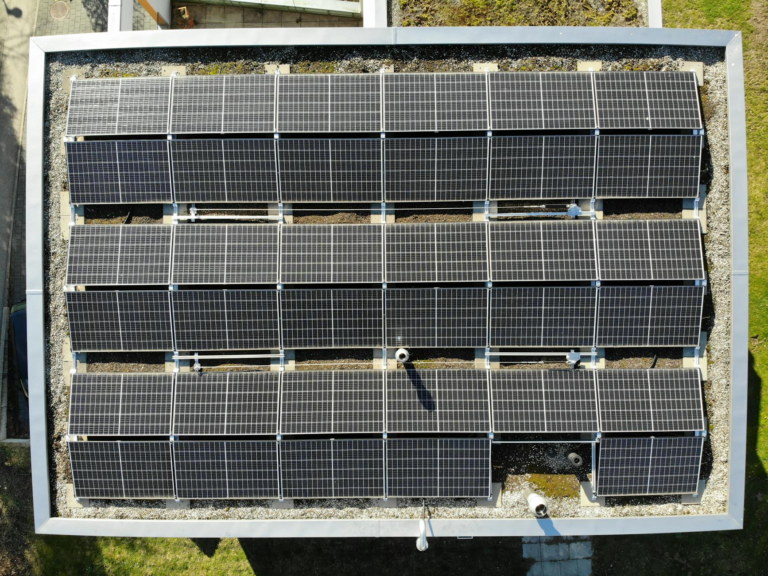 Aerial view of solar panels on a rooftop in Zurich, showcasing clean energy solutions.
