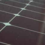 Detailed view of solar panel cells for alternative energy generation and innovation in technology.