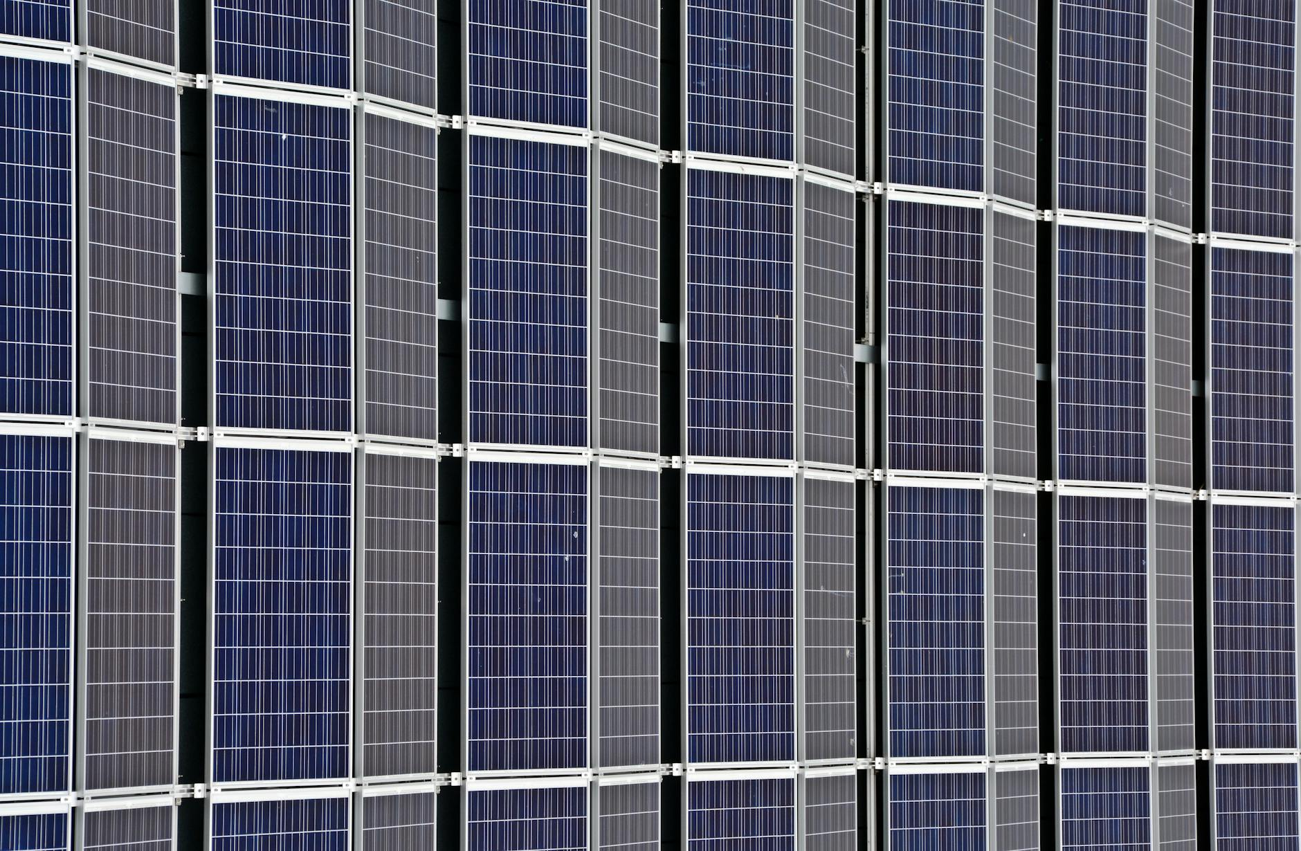 Close-up of multiple solar panels representing renewable energy and sustainability.