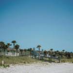Charming beach homes on Belleair Beach, Florida with a clear blue sky backdrop.