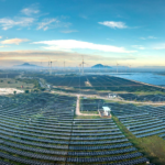 Panoramic aerial shot of a solar and wind farm in Vietnam showcasing renewable energy technologies.