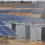 Expansive solar panel field in a rural area harnessing solar energy. Sustainable and renewable energy source.