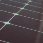 Detailed view of solar panel cells for alternative energy generation and innovation in technology.