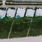 Stunning aerial view of beachfront homes with pools in Fort Pierce, Florida.