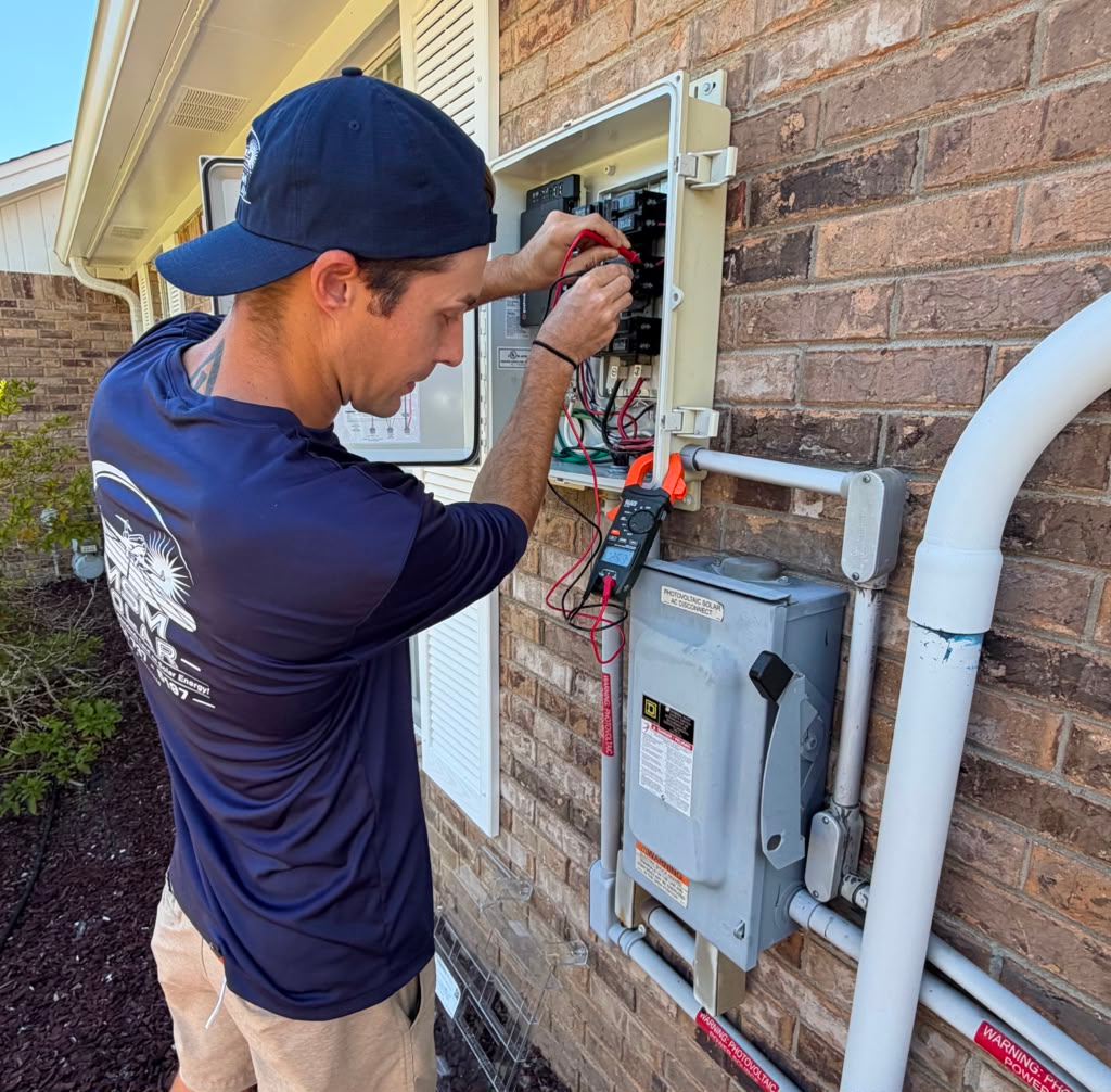 MSM Solar technician testing a solar AC disconnect