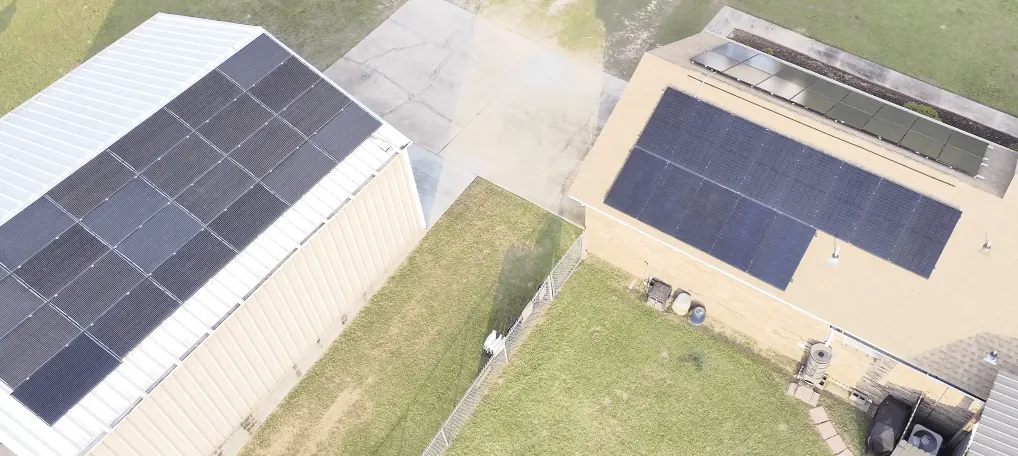 Aerial view of a dual-building solar installation