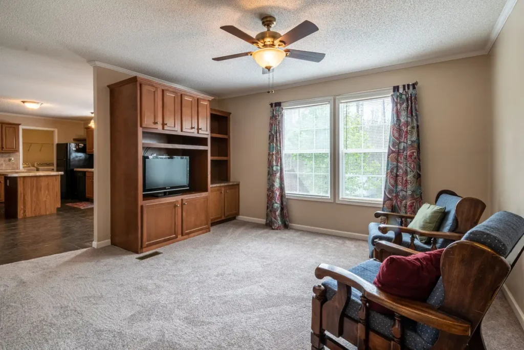Ceiling fan running in a bright living room