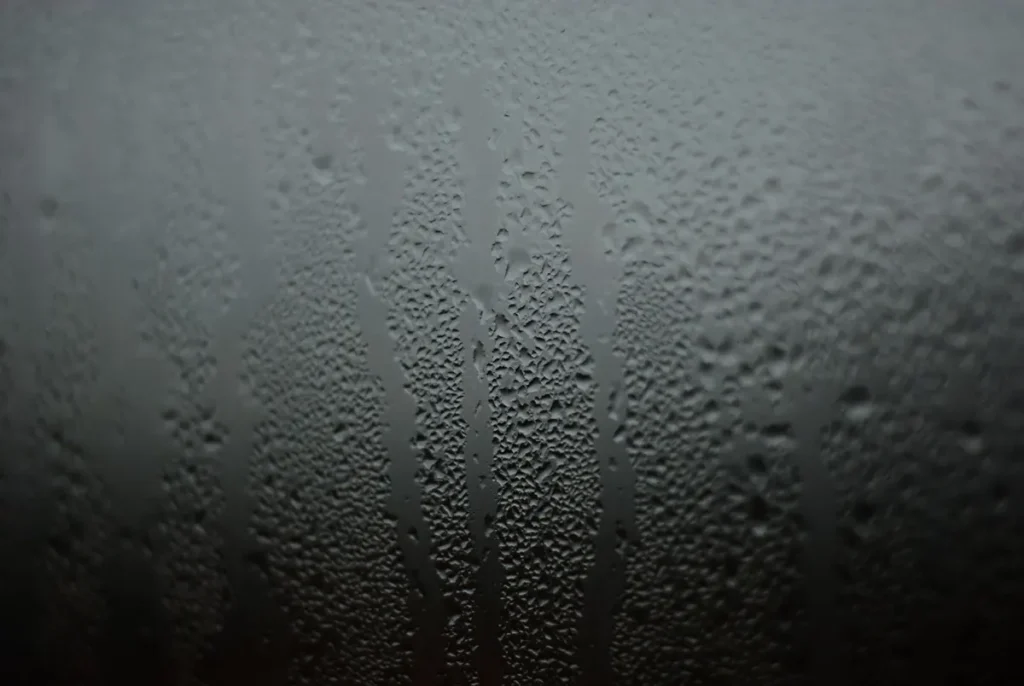 Water droplets and condensation on a window pane