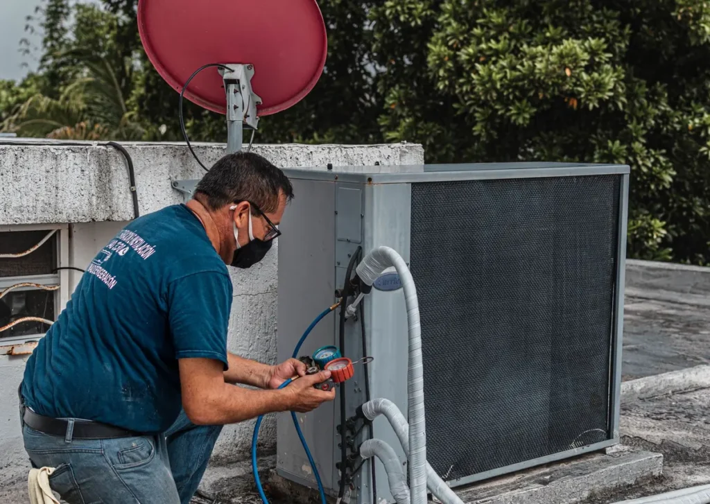 Technician servicing an outdoor HVAC unit at a Florida home